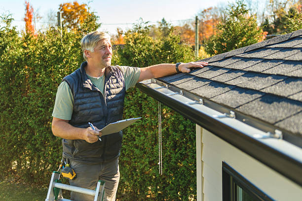 Professional Storm Damage Roof Repair technician working in Underhill, VT